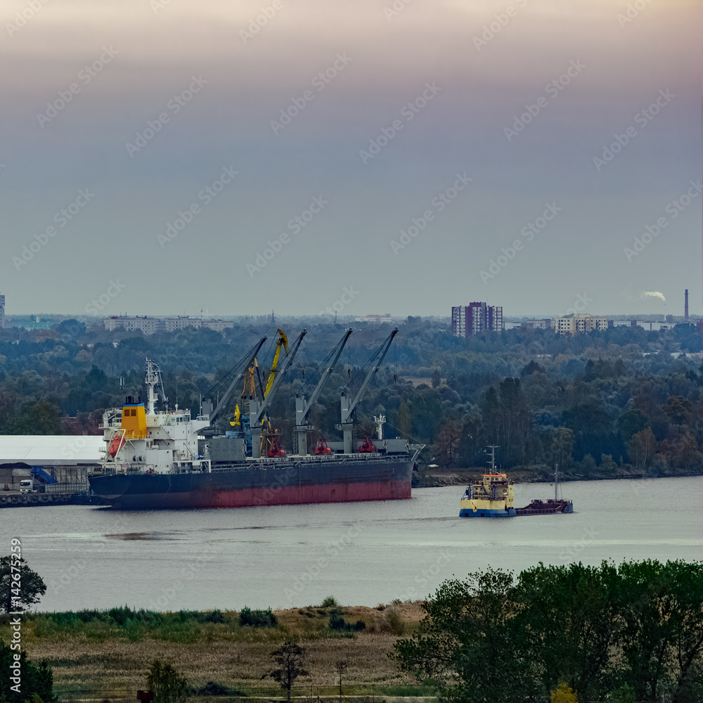 Cargo ship (bulk carrier) loading in port at Riga, Latvia Cargo ship (bulk carrier) loading in port at Riga, Latvia