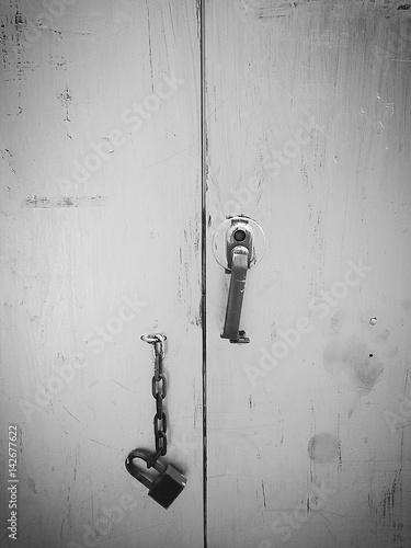 Old steel cabinet with the chain and key in black and white color mode
