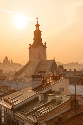 Roofs of old houses and Latin Cathedral at sunset, downtown Lviv, Ukraine photo