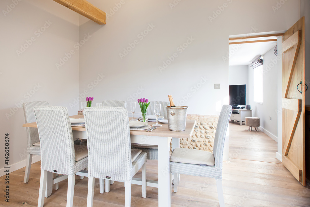 table setting with tulips in bright kitchen table setting with tulips in bright kitchen
