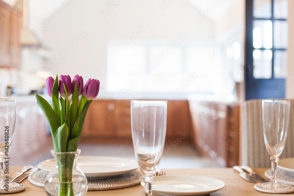 table setting with tulips in bright kitchen