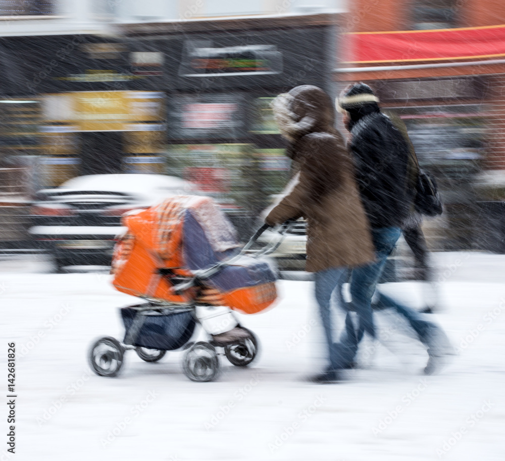 Fototapeta premium Mother with small child in the stroller