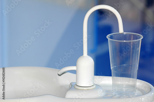 Water fountain at the dentist. Basic dentistry equipment used for the health and care of both adults and children's oral hygiene.