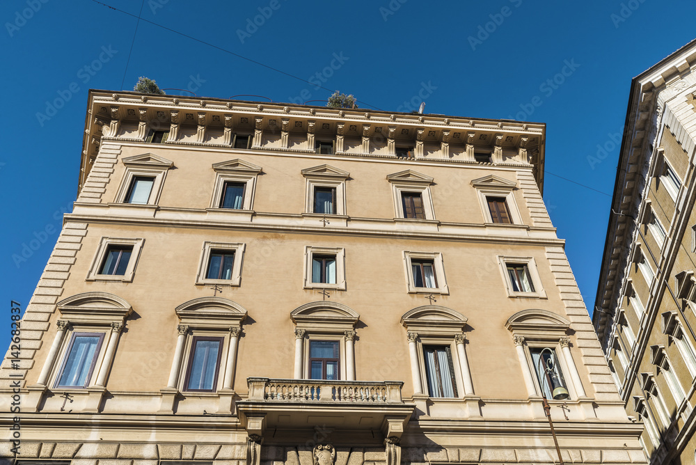 Facade of an old classic building in Rome, Italy