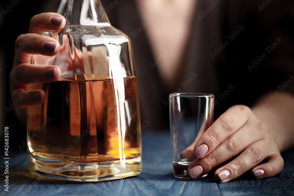 woman in depression, drinking alcohol on dark background woman in depression, drinking alcohol on dark background