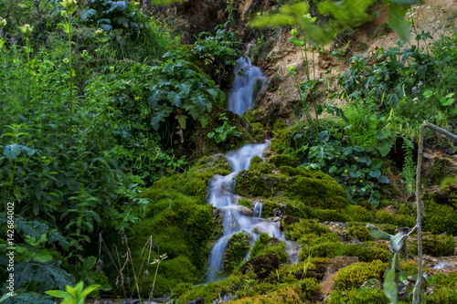 Waterfall on mountain river in Carpathian Mountains , Romania