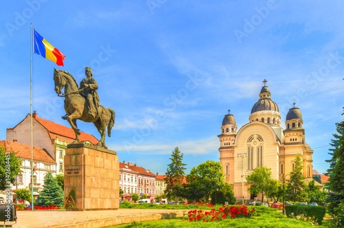 Avram Iancu statue and ortodox church in the Roses Square, Targu Mures, Transylvania, Romania. photo