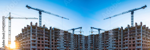 Panorama of construction at the background of blue sky