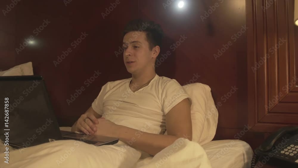 Man using laptop and has conversation via skype. Man using laptop and has conversation via skype.