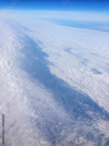 Cloudscape with clouds and blue sky from airplane Point of view