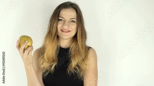 Wallpaper Mural Woman eating an yellow pear, isolated, steadycam
 Torontodigital.ca