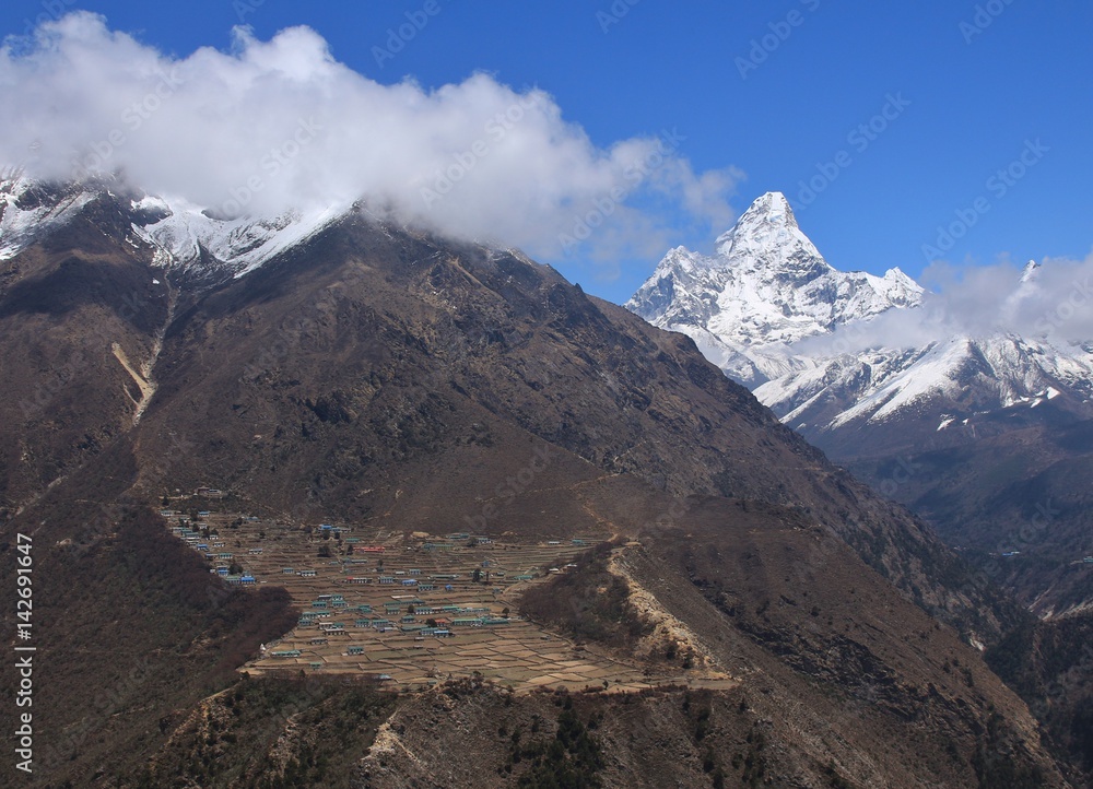 Sherpa village Phortse. Peak of Ama Dablam. Spring scene on the way to Everest base camp, Nepal.