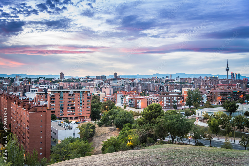 Madrid cityscape at sunset with purple clouds