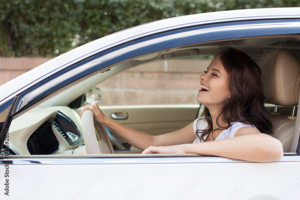 Young Happy Smiling Woman Driving Car