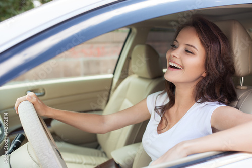 Young Happy Smiling Woman Driving Car © yuriyzhuravov