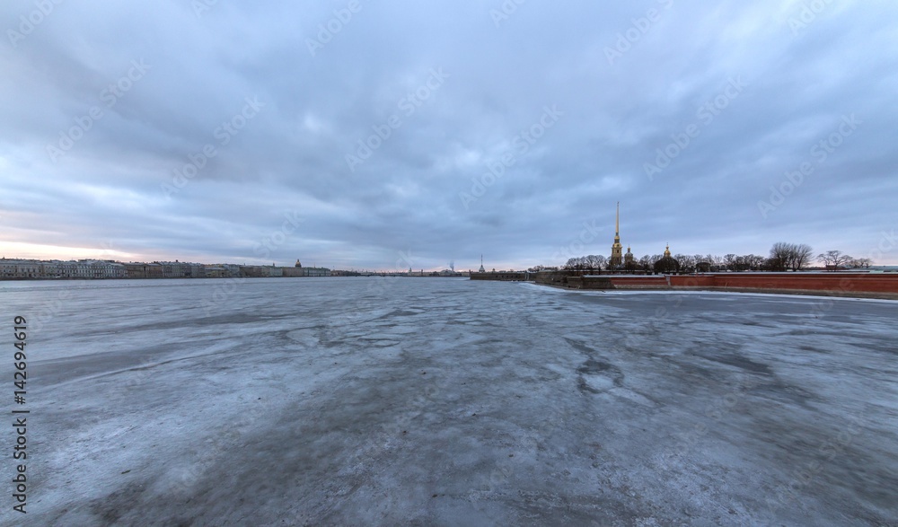 Panorama of the Neva River and St. Petersburg on a spring evening from the Trinity Bridge/ View of the Peter and Paul Fortress and the Arrow of the Vasilievsky Island, St. Petersburg, Russia