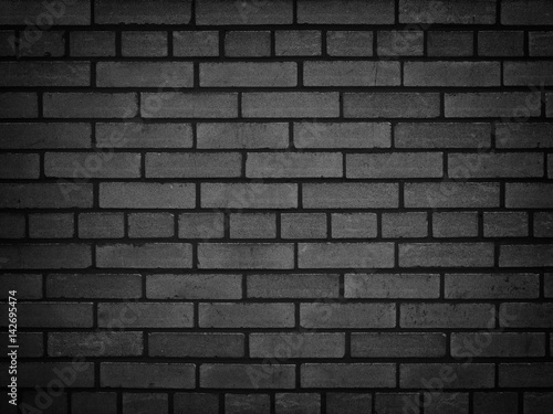 Dark brick wall, texture of a black brick background