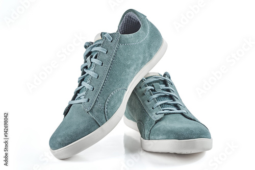 Pair of man's shoes front view. Suede sneakers isolated on white background.