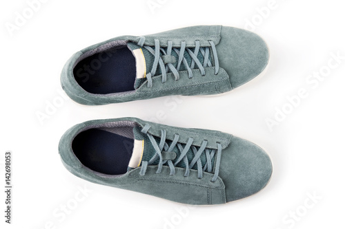 Pair of man's shoes top view. Suede sneakers isolated on white background.