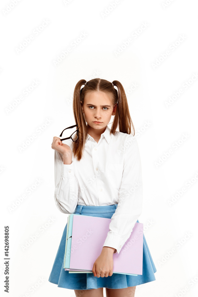 Young emotional girl in uniform posing, isolated on white background. Young emotional girl in uniform posing, isolated on white background.