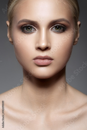 Close up portrait of beautiful woman face. Make up smoky eyes.