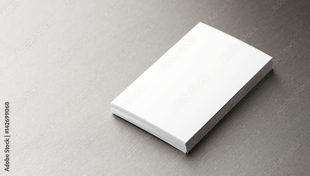 Top view of business card over gray background. Horizontal shoot. Top view of business card over gray background. Horizontal shoot.