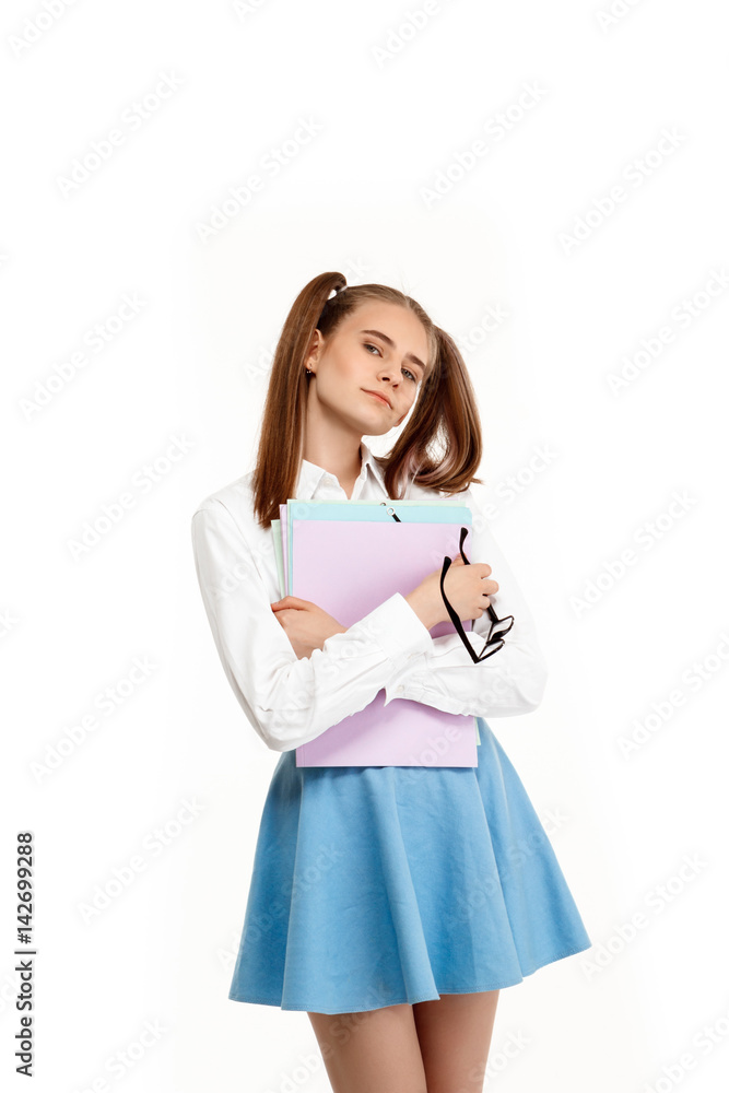 Young emotional girl in uniform posing, isolated on white background. Young emotional girl in uniform posing, isolated on white background.
