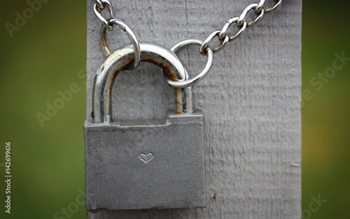 Lock with a chain and a grey board