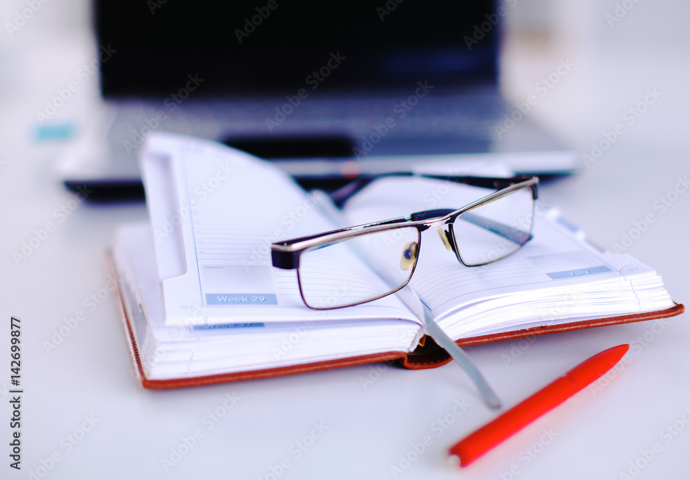 Group of multicolored office folders and glasses Group of multicolored office folders and glasses