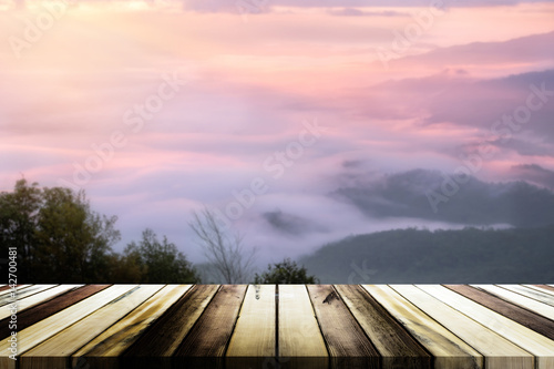 Empty wooden table with blurred sea mist and mountain background. Product display template © doidam10