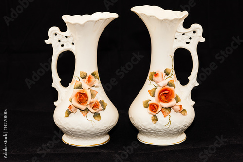 two porcelain flower vases (seven and a half inches tall, three and a half wide)  photo