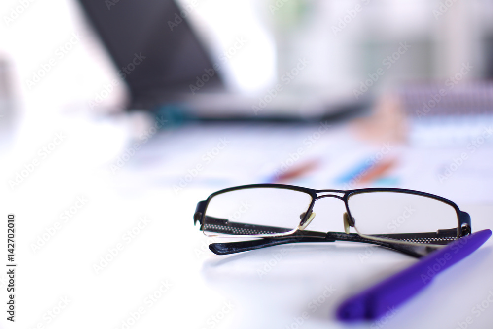 Business composition with glasses and pen over clear pages Business composition with glasses and pen over clear pages