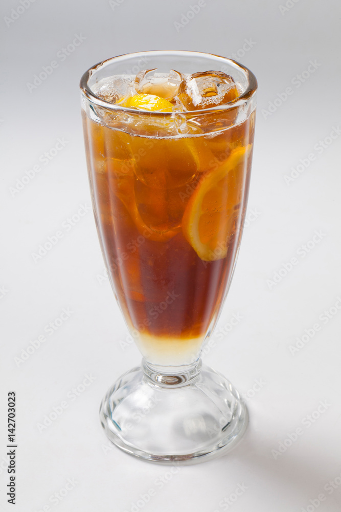 cold tea with lemon and ice in the glass. cold tea with lemon and ice in the glass.