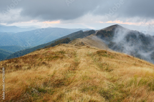 Autumn landscape with a road in the mountains