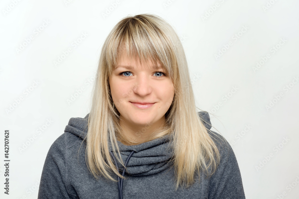 Beautiful girl makes an appearance on a white background Beautiful girl makes an appearance on a white background