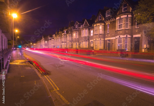 Evening Exeter. Street with night lights. You can see tracers from cars passing by. Devon. England