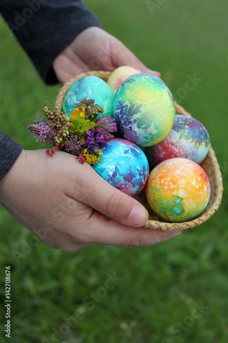 Toddlers hands holding easter eggs