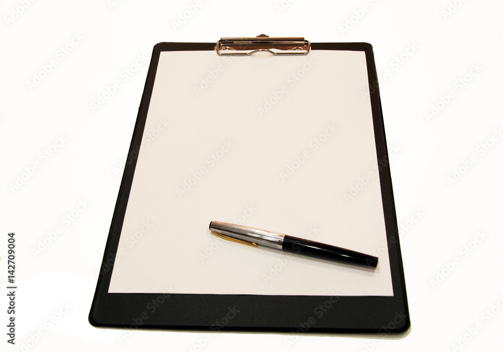A white sheet of paper with a pen mounted on a folder A white sheet of paper with a pen mounted on a folder