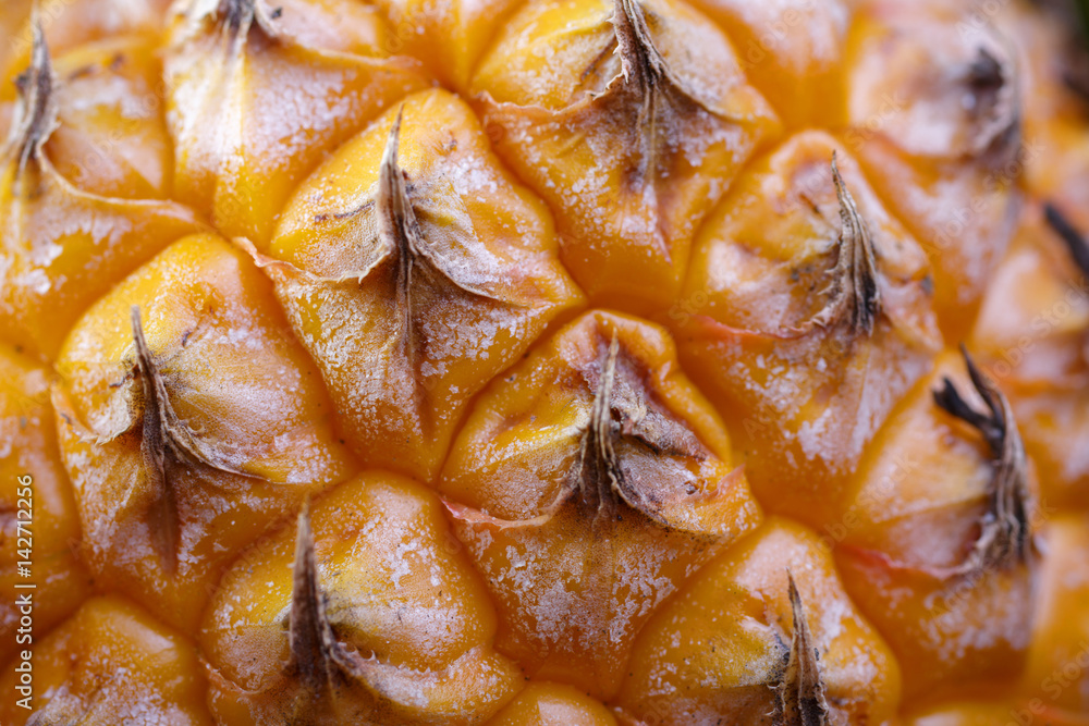 Surface of pineapple skin macro. Fresh exotic fruit snapshot on the side. Background of bright fruits. Surface of pineapple skin macro. Fresh exotic fruit snapshot on the side. Background of bright fruits.