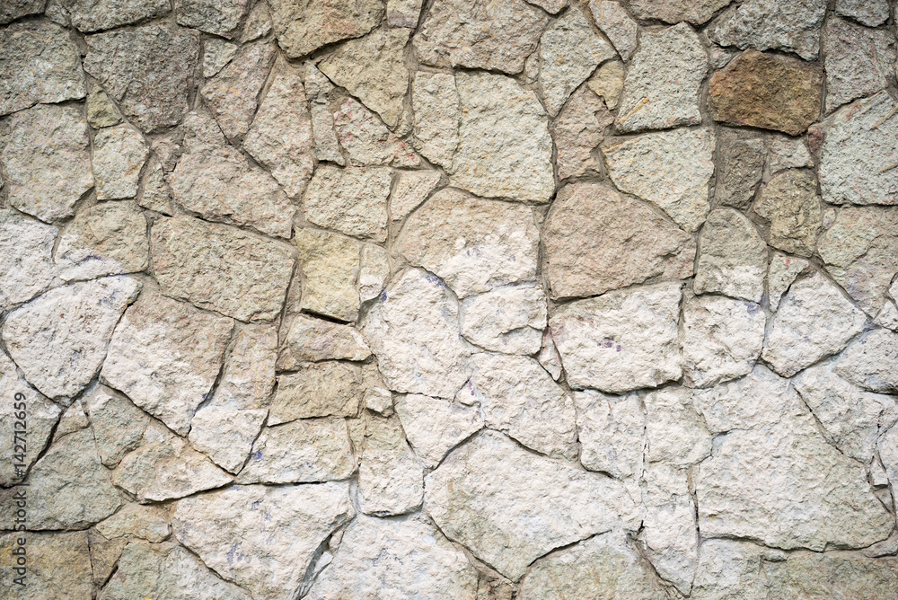 Stone wall background.Vignette effect. Stone wall background.Vignette effect.
