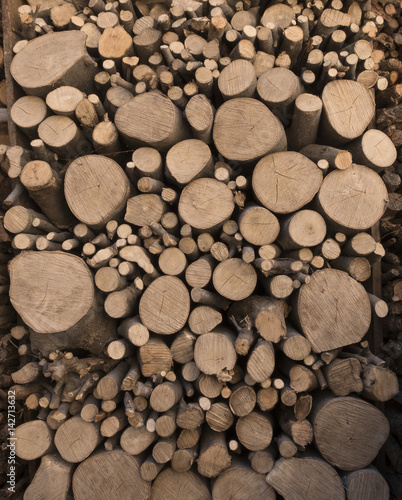 wooden logs cut and stacked