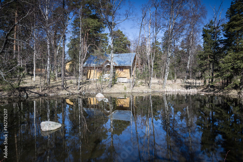 Small building and pond in Seurasaari island in Finland