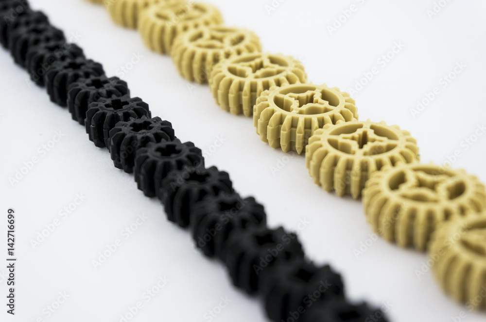 Many dark and light gears. Isolated on white background. Many dark and light gears. Isolated on white background.