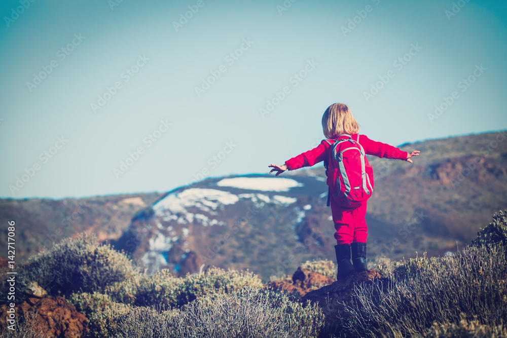 little girl travel hiking in mountains