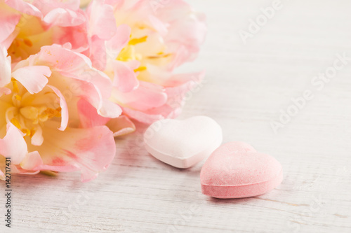 Bath bombs on white wooden background