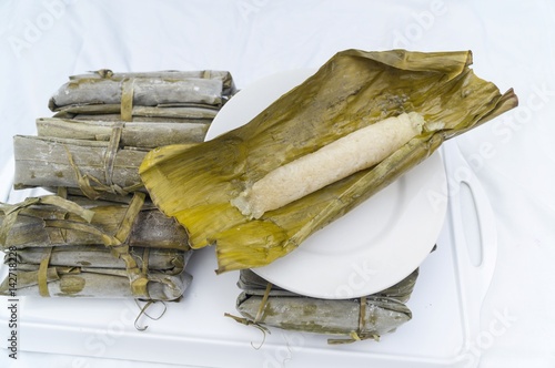 Suman rice cake from the Philippines wraped in Banana leaves and cooked