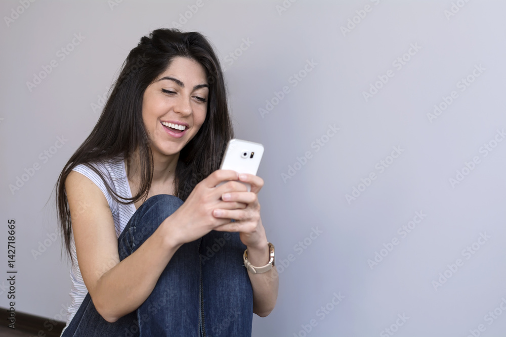 Portrait of beautiful smiling woman using mobile phone Portrait of beautiful smiling woman using mobile phone