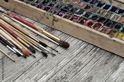 Wallpaper Mural Box with watercolors and brushes on a wooden surface Torontodigital.ca