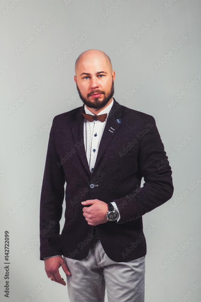 Businessman standing on dark gradient background Businessman standing on dark gradient background