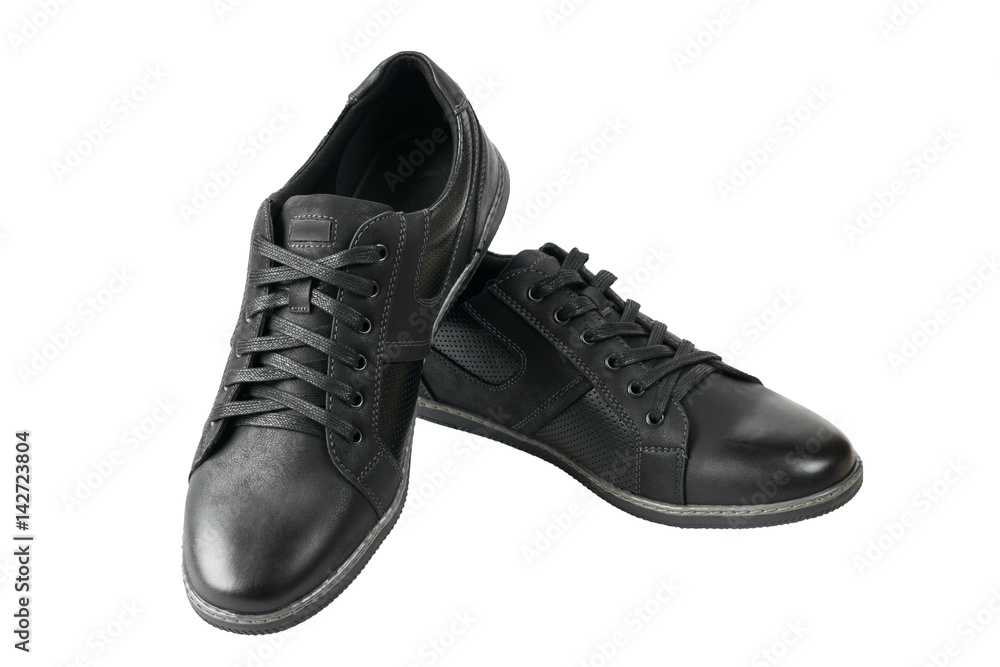 Beautiful pair of black mens sport shoes isolated on white background. Beautiful pair of black mens sport shoes isolated on white background.